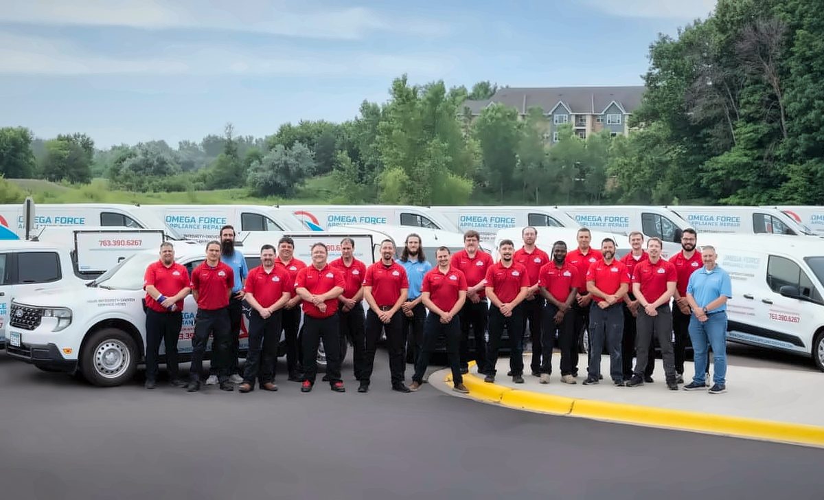 The Omega Force Appliance Repair team with their service vans